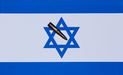 An Israeli flag that has a bullet on it, and is ready to defend itself against war, stop war.