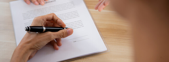Hands of business woman signing and signature on contract about agreement with partner at office, document and deal with law while witness signing, recruitment and job interview, business concept.
