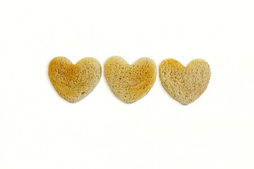group of Roasted cut out heart shaped slice of toast bread in white background,copy space