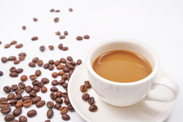 Black coffee and coffee beans on white background