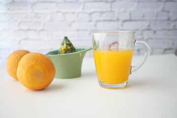 squeezing oranges into orange juice,
