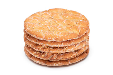 A Stack of Round Salt Crackers with Sesame Isolated on White Background. Dry Snacks - Isolation