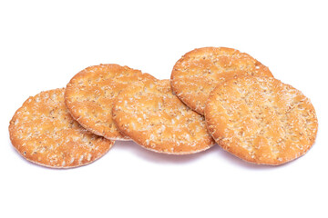 A Heap of Round Salt Crackers with Sesame Isolated on White Background. Dry Snacks - Isolation