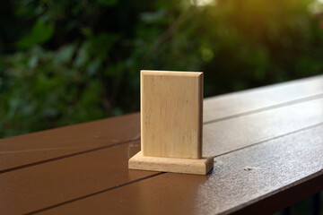 small square wooden board, there is space for writing or attaching table numbers, attached to the...