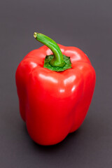 Fresh Red Sweet Bell Pepper on Black Background