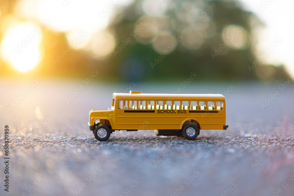 Canvas Prints Model of classical american yellow school bus for transporting of kids to and from school every day. Concept of education in the USA