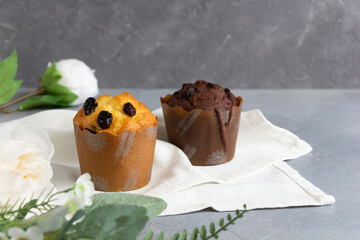 Homemade delicious cupcakes with raisin and chocolate decorated with flowers.