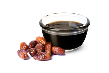 Date syrup in glass bowl and dried dates palm fruit isolated on white background.