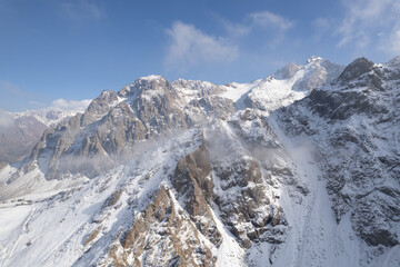 Aerial shot of mountain landscape into the clouds