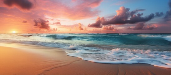 Vibrant ocean sunrise on tropical seaside inspiring coastal landscape beach shore and sea horizon With copyspace for text - obrazy, fototapety, plakaty