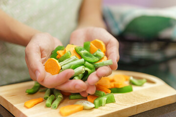 Colorful view of peaces of vegetables on a cutting board