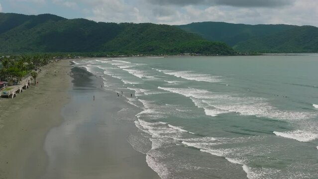 The coast with hotels and tourists, a famous place for surfing in the Philippines. Sabang Beach, Baler, Aurora, Philippines.