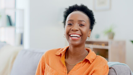 Portrait, funny and a black woman laughing on a sofa in the living room of her home to relax on the weekend. Face, smile and comedy with a happy young person in her apartment to joke for humor - obrazy, fototapety, plakaty