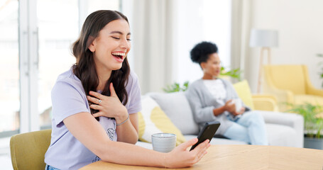 Obraz premium Phone, laughing and young woman in the living room watching a video on social media or mobile app. Happy, cellphone and female person reading funny post on the internet in the lounge at apartment.