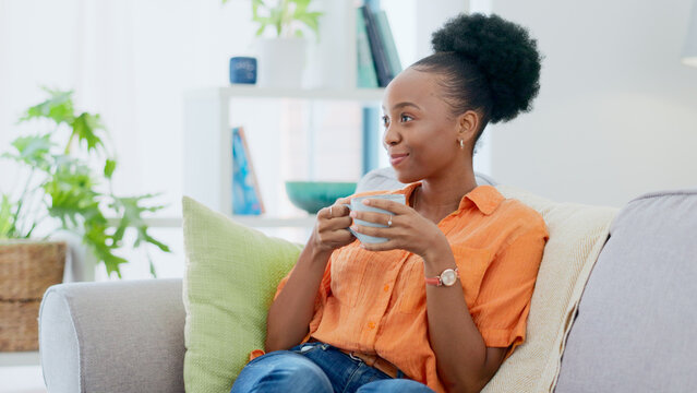 Black Woman, Smiling And Sofa With Hot Beverage, Relaxing And House For Self Care, Lounge And Break. Me Time, Comfort And Quality Time In Home, Lounge And Day Off For Resting, Laughing And Happiness