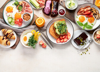 Healthy breakfast eating concept, various morning food on light background