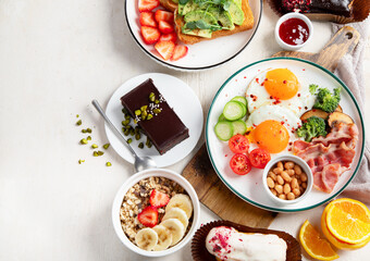 Healthy breakfast eating concept, various morning food on light background