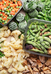 A set of foods for the winter. Various of frozen vegetables and berries