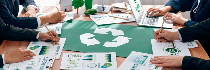 Group of business people planning and discussing on recycle reduce reuse policy symbol in office meeting room. Green business company with eco-friendly waste management regulation concept.Trailblazing - obrazy, fototapety, plakaty