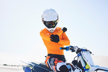 Moto, person or rider with injury on bike in desert for sports on holiday, vacation or trip in...