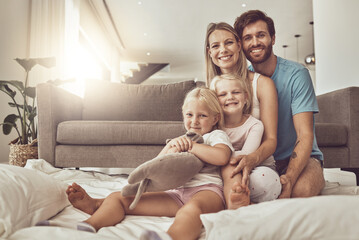 Fototapeta premium Happy family, portrait and hug on living room floor for weekend, holiday or relax together at home. Mother, father and children smile in happiness or love for embrace, fun bonding or support in house