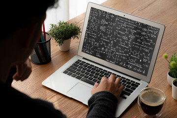 Mathematic equations and modish formula on computer screen showing concept of science and education