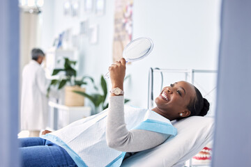 Smile, mirror and black woman at dentist on chair in clinic, tooth treatment and cleaning. Reflection, dental orthodontics and happy person teeth whitening, oral hygiene and healthcare for wellness - Powered by Adobe