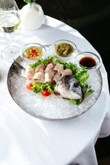 ceviche from dorada. glass with white white wine on the backgrou