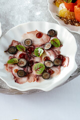 seafood appetizers on plates served in a bowl with ice