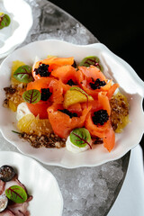 seafood appetizers on plates served in a bowl with ice