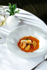 tomato soup with seafood. restaurant menu