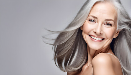 Gorgeous aging mature woman with long gray hair and happy smiling Beautiful woman with smooth healthy face skin.  © 식 땡