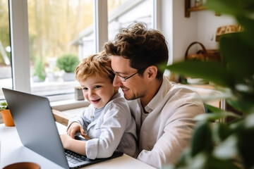 Young assistant helps working father at home with laptop.