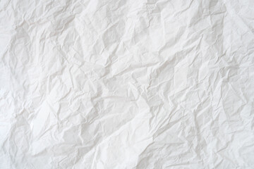 Wrinkled or crumpled white stencil paper or tissue after use in toilet or restroom with large copy space used for background texture in decorative art work
