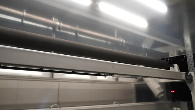 Automatic polyethylene plastic bag production machine with lighting effect.  Industrial line for the production of plastic packaging film. Factory for the production of packaging materials
