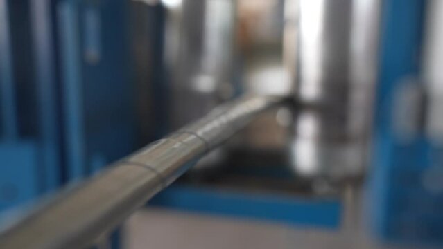 Manufacture of power cable. Applying an insulation layer to the cable. A powerful armored electric cable is subjected to heat-shrinkable material application in production
