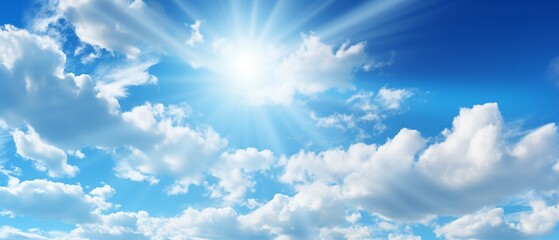 Naklejka na ściany i meble Vivid Panorama: Bright Blue Sky with White Clouds and Radiant Sun