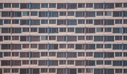 The walls of a multi-story building as a background. Texture