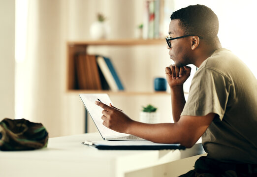 Black man, laptop and reading military information, planning or army surveillance indoor at base. Computer, soldier and concentration on web research at data center for cyber security and protection