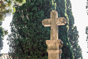 Old stone cross outdoors in the cemetery