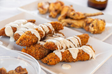 Breaded chicken fingers with mayonnaise sauce