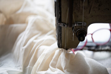 Sewing machine and fabric, close up. Selective focus.