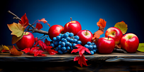 Obraz na płótnie Canvas Red yellow apple on a blue background. Juicy ripe beautiful fruit.
