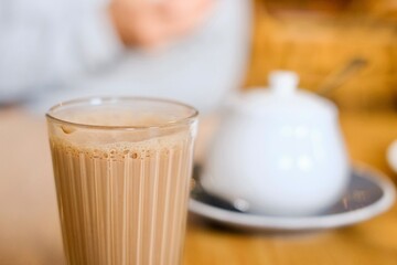 A cup of Nepalese spiced milk tea (masala chai) with sugar pot at Tapari Nights, a restaurant in...