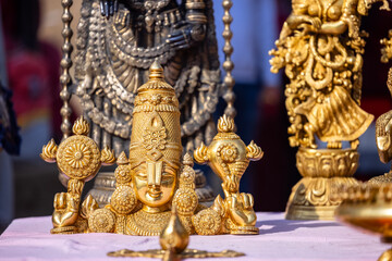 Brass metal art, Handmade Indian cultural and hindu god sculpture souvenir made with brass with plain background. Selective focus.