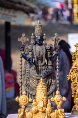 Fototapeta premium Brass metal art, Handmade Indian cultural and hindu god sculpture souvenir made with brass with plain background. Selective focus.