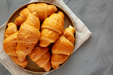 Homemade Croissants on a Plate, top view. Copy space.