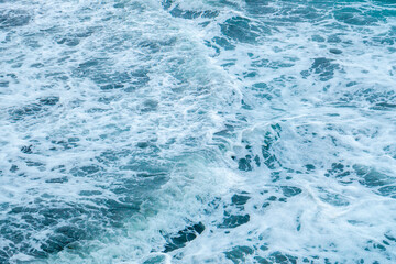 Beautiful blue wave water for abstract background from natural sea ocean in summer, motion texture pattern from outdoor seascape beach travel, aerial view bright splash surface beauty lanscape