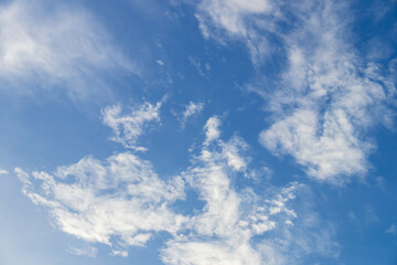 Fototapeta premium Blue sky with fluffy clouds; soft white clouds on blue sky. Skyscraper background.