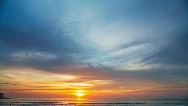 .time lapse sweet sky in beautiful sunset above the ocean at Karon beach Phuket. .abstract nature background..Sunset with sweet color light rays and other atmospheric effects..4k resolution.